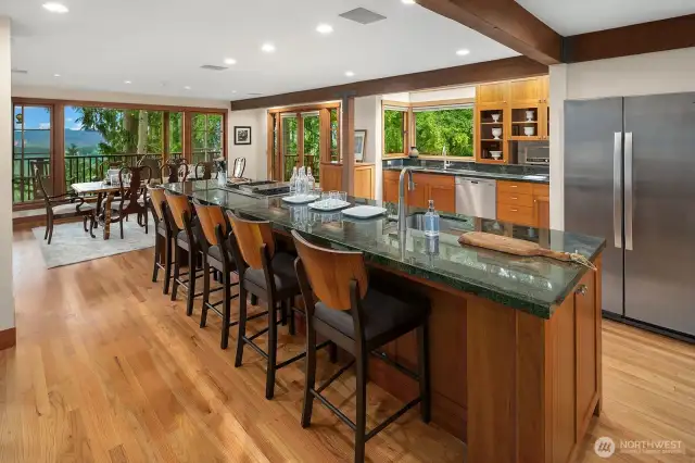 Extra wide commercial grade refrigerator, two sinks, green granite countertops and custom maple cabinetry