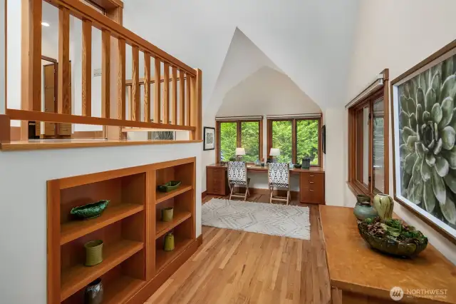 Home Office with wall of windows, custom shelving and integrated desk for two.