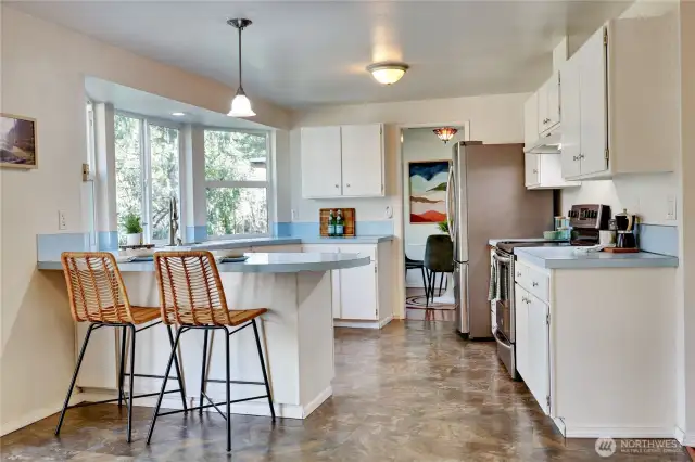 Full view of kitchen, looking towards dining room.