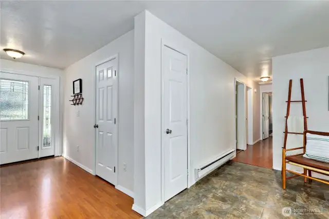 View from kitchen, looking towards the front entrance and hallway to bedrooms and bathrooms.