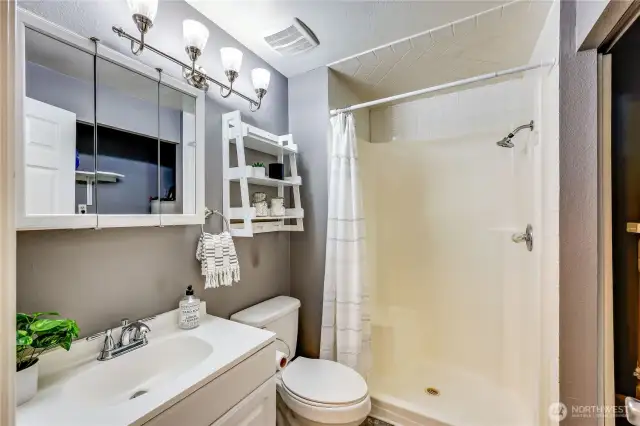 3/4 bath with step in shower. Hot water heater and washer/dryer are not pictured.
