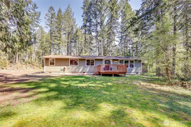 Nearly 2.5 acres, with golden afternoon light filtering through the trees.