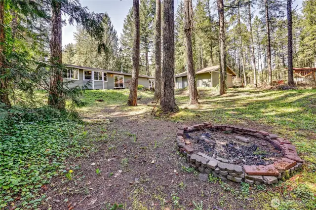 Fire pit at the back of the property, looking towards the house.