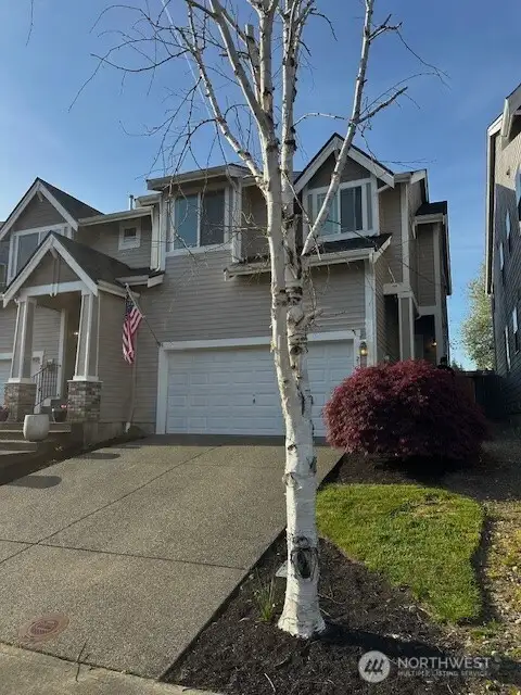 Home on right. Connected at garage to neighboring townhouse