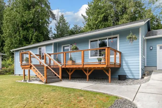 Front of home with attached garage.