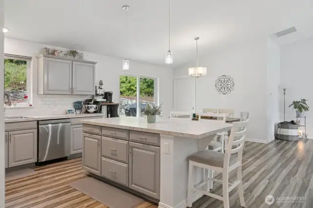 Kitchen is light and open to living room and dining area.