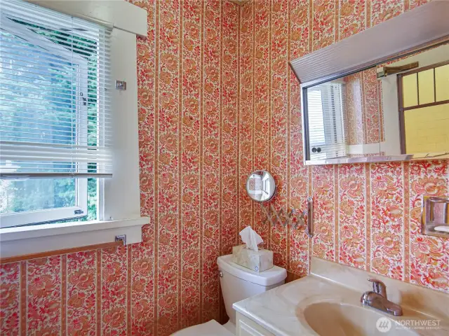 This bathroom has an original tiled shower with multiple shower heads. Come see it in person!