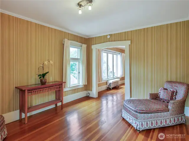 This is the sitting room on the top floor, complete with built-ins in the closet. Could serve as another bedroom.