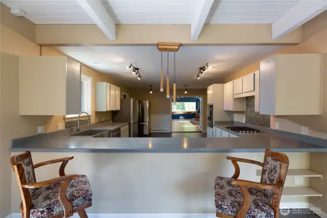 Large kitchen has all new KitchenAid appliances. French doors lead to a very large bonus room in distance over 700 sq feet off kitchen.