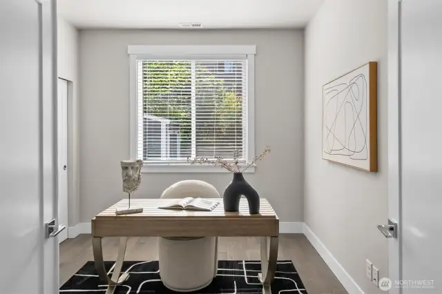 Desirable main floor bedroom offers incredible versatility, ideal as a home office, flex space, or suitable for multi-generational living.