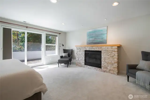 Gas burning fireplace and balcony in the primary bedroom add to the ambience of this inviting space.