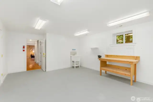 This extra finished room in the lower level is perfect for an exercise room, craft area, storage, or future kitchen for a M-I-L too!