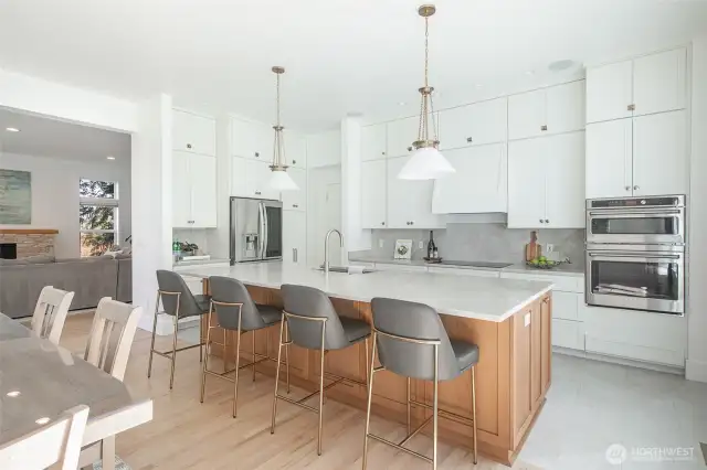 The newly remodeled kitchen has been tastefully designed for the most discerning cooks as well as large gatherings with quartzite counters, extra long island, custom pendant lighting and stainless steel appliances.