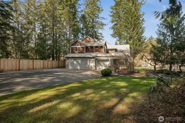 Oversized 3-car garage is great for your  summertime water toys! Lots of off-street  parking + room for smaller RV parking to the  left of the garage pad.