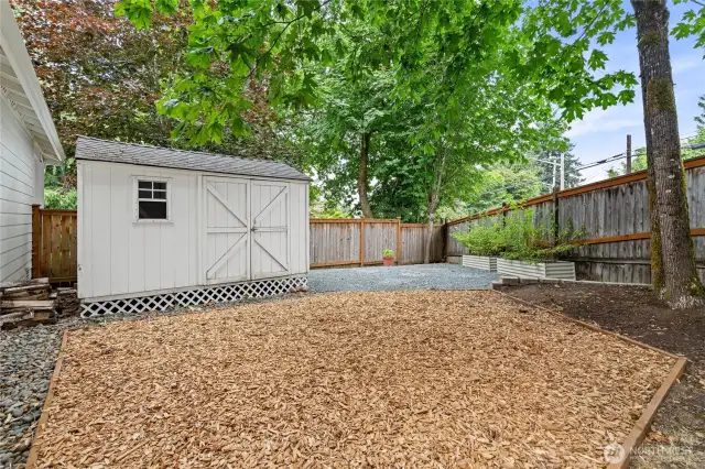 Large garden shed and fire pit area ready for your enjoyment.