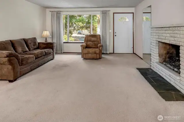 Formal living room with large picture windows.