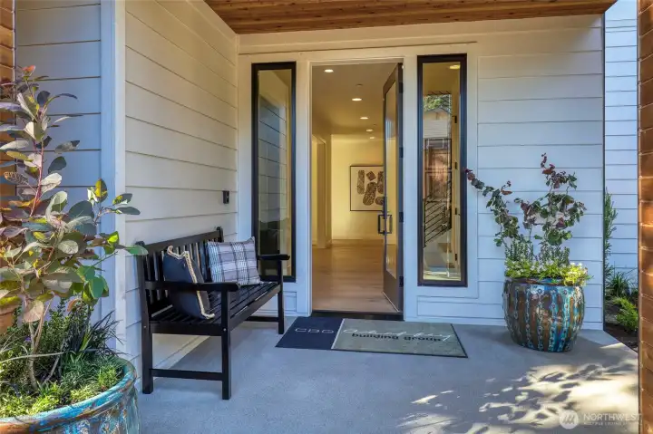 Large covered front entry porch with a convenient package delivery alcove.