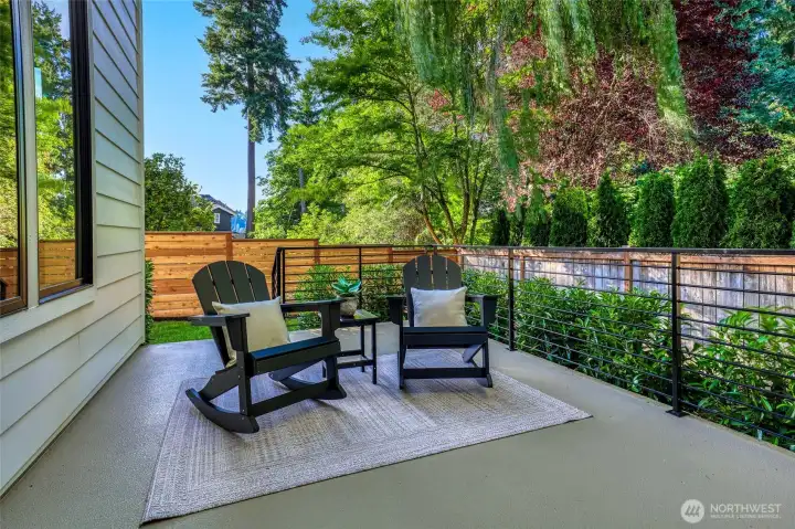 A tranquil private BBQ deck unlike any other. This little corner of the property feels like you're in an oasis far, far away! it's wrapped in soft layers of lush green landscaping. Willow boughs, Laurel hedges, tall Evergreens, Maples, Arborvitae, and steps to the lawn below.