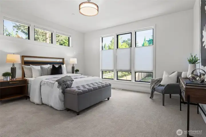 This is an oversized upper level guest ensuite. Plenty of room for a dresser or desk. Top-down-bottom-up blinds installed. Bright, sunny bedroom.