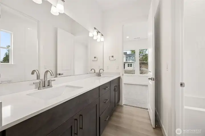 First two bedrooms joined by bathroom  Photos are of a different home. Standard finishes and features are similar and can be modified.