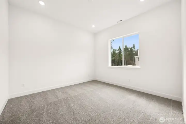 Second Primary Bedroom with 3/4 bath  Photos are of a different home. Standard finishes and features are similar and can be modified.