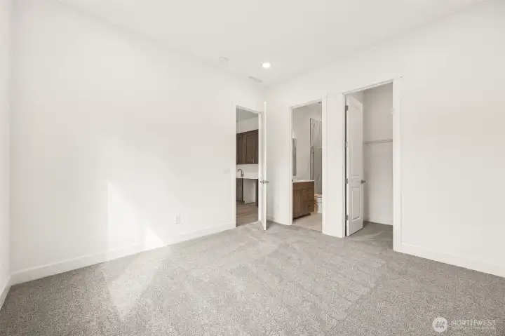 Second Primary Bedroom with 3/4 bath  Photos are of a different home. Standard finishes and features are similar and can be modified.