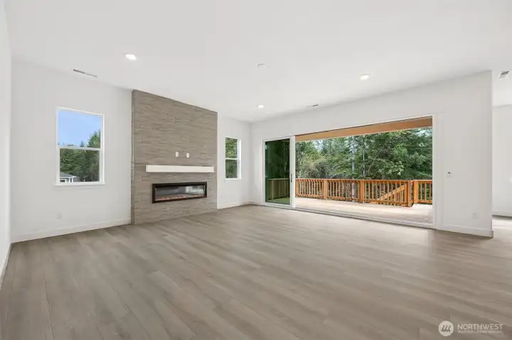 Great Room with multi-slide doors. Photos are of a different home. Standard finishes and features are similar and can be modified.