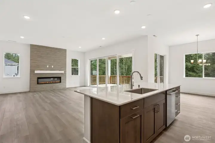 Great Room with multi-slide doors. Photos are of a different home. Standard finishes and features are similar and can be modified.