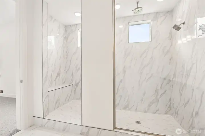 Primary bathroom with walk-in shower. Photos are of a different home. Standard finishes and features are similar and can be modified.