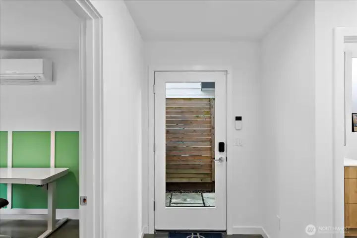 front door on lower level, with 2nd bedroom adjacent