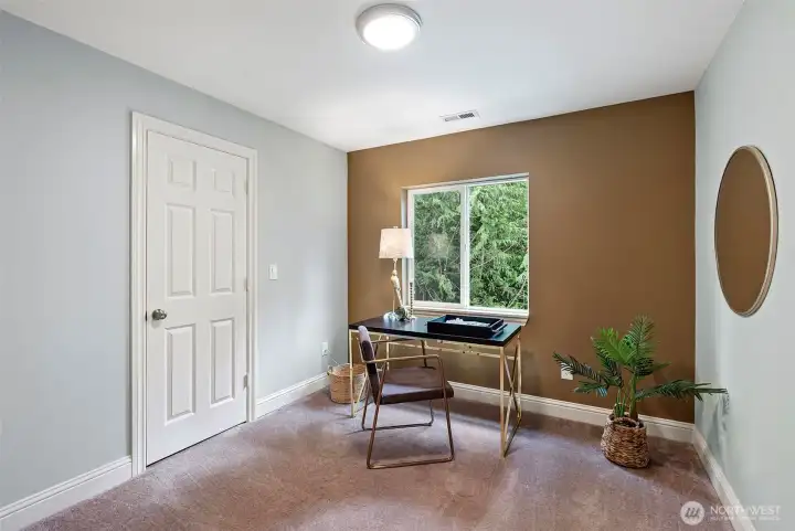 Room 1 – Den/Bedroom – A versatile room that can function as a den, office, or bedroom, offering flexibility for changing needs.