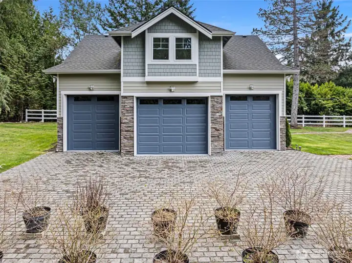 Detached 3-Car Garage with 2 finished rooms above – The large detached garage offers extensive parking, storage, and workspace potential.