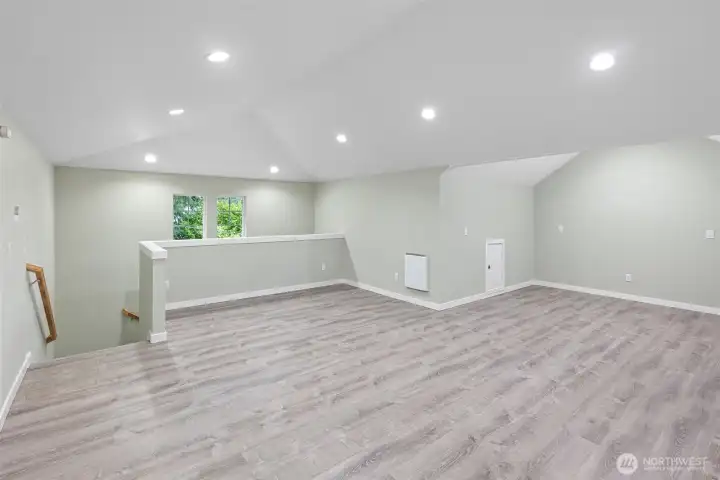 Finished Garage Living Area – Inside the garage is a finished living room space with an additional bonus room or bedroom off the main area.