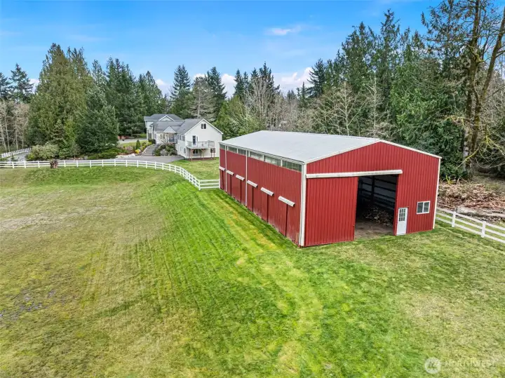 Barn Exterior Facing House – The back side of the barn looking toward the home highlights the spacious layout of the property.