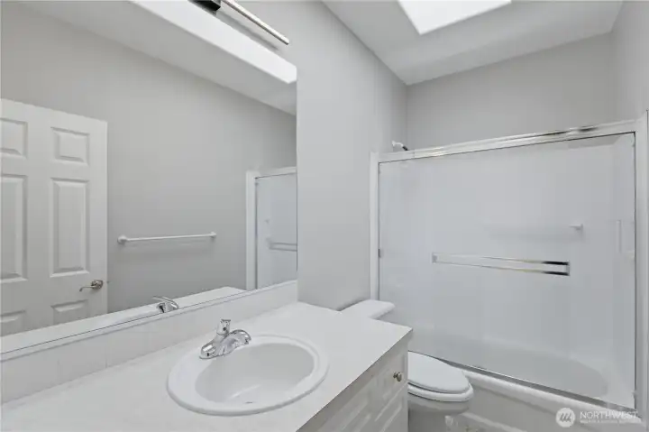 Guest bathroom with tub