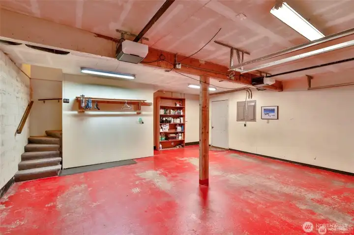 2 car attached garage has adjacent storage area and 1/2 batg