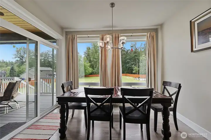 Dining room next to kitchen, door opens to covered porch over looking your own park!