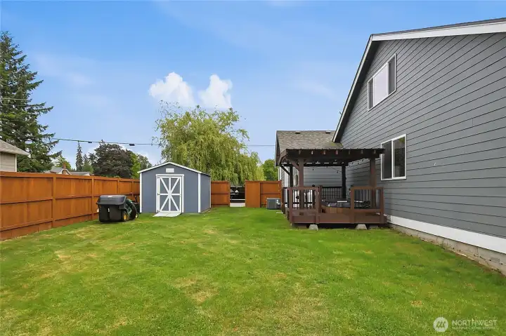 Side yard with storage shed.