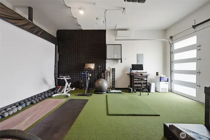 Garage 3rd bay has Golf Simulation System that can be purchased separately from the home.