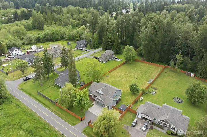 The lot extends past the rear fence by about 20 feet into the trees.
