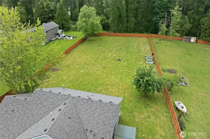 Aerial view of part of the house and its rear/side yards.