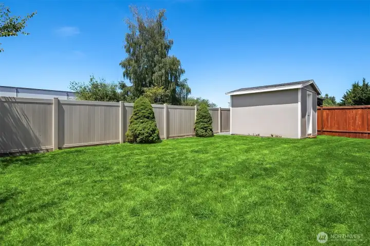 Nice fully fenced yard with shed