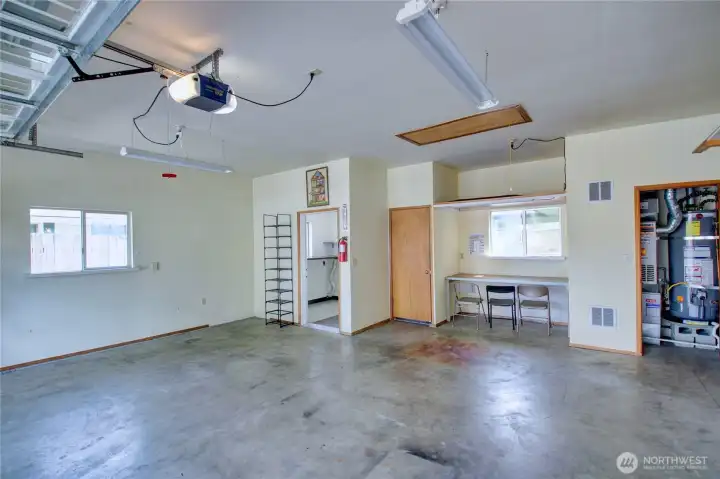Garage showing utility closet and heated laundry room (left)