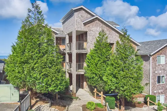 Shingled condos on the hill above the sea
