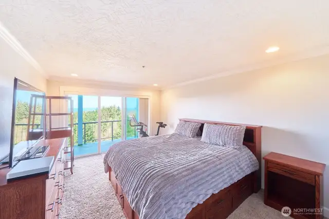 Primary bedroom with slider to balcony