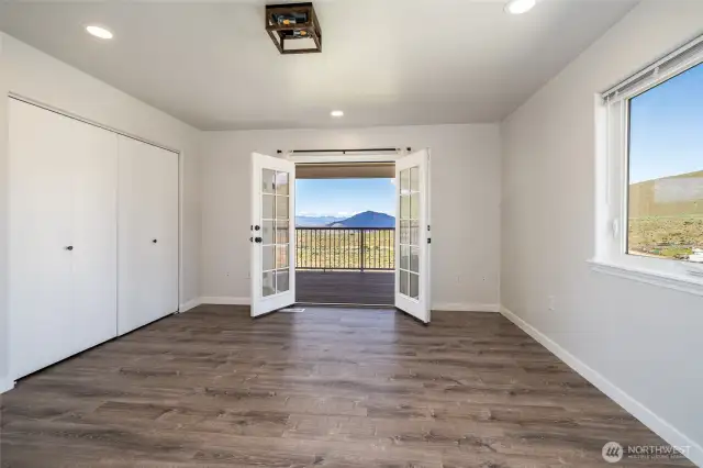 House 1 Primary Bedroom w/French doors to new trex deck.