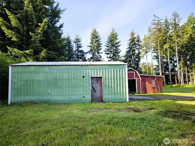 Shop garage with storage building behind.