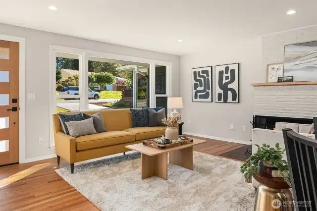 Open and inviting living room has a huge window to let all the sunshine in. Picture from previous listing