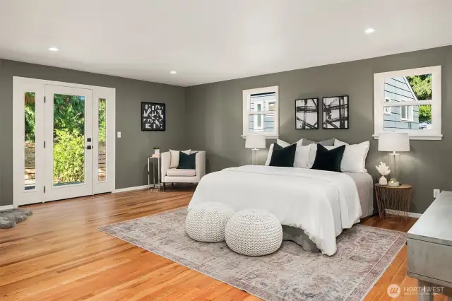 Large and expansive primary bedroom has room for everything. King sized bed, reading area, work out space? Picture is from previous listing.