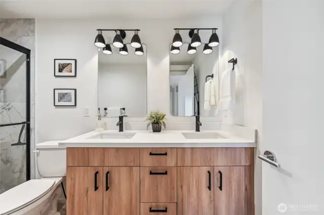 Spa-like en-suite bathroom is spacious and serene.